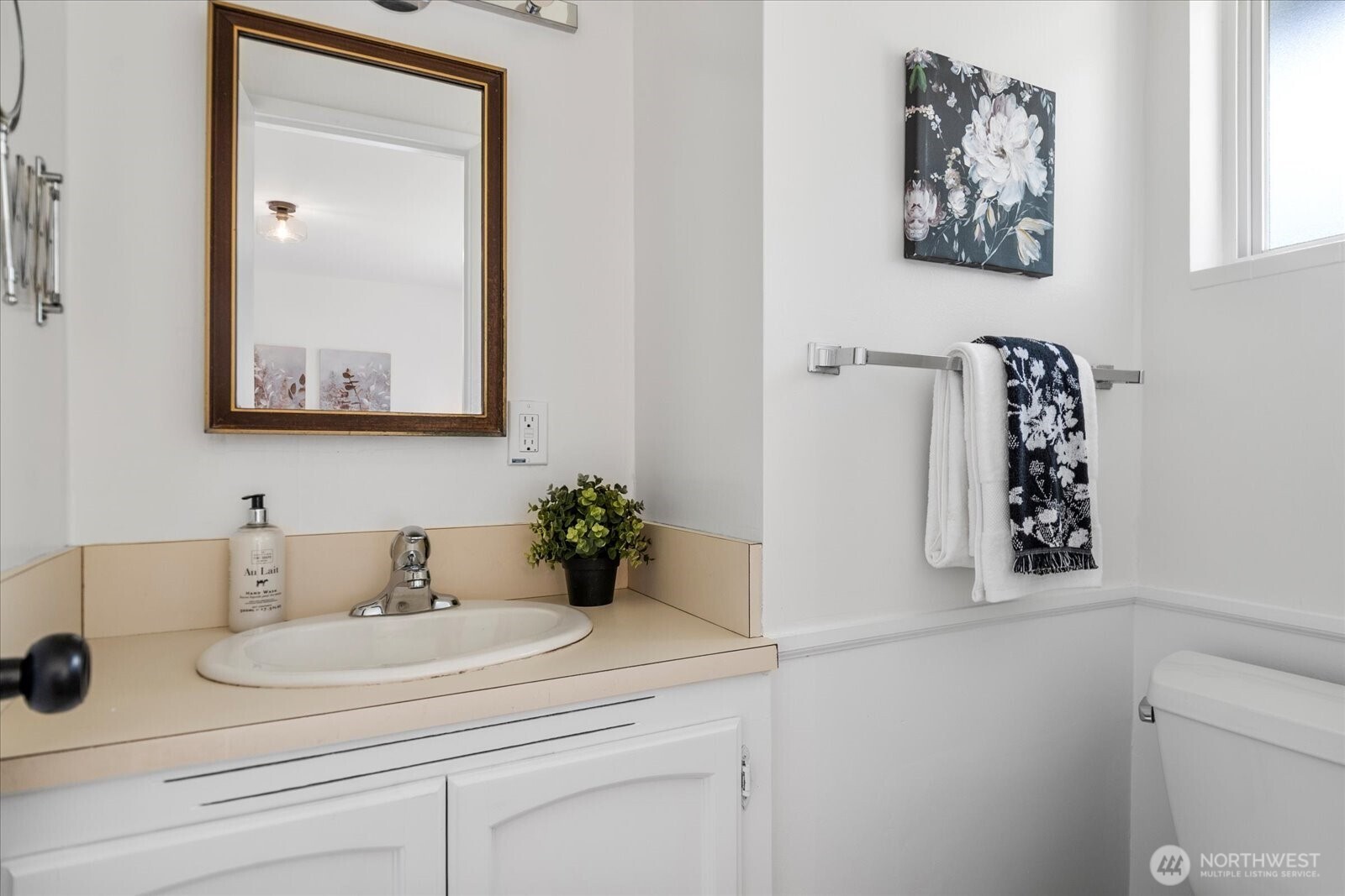 23908 80th Place West Edmonds, WA 98026 - Photo 15 of 40 a bathroom with a sink and a mirror