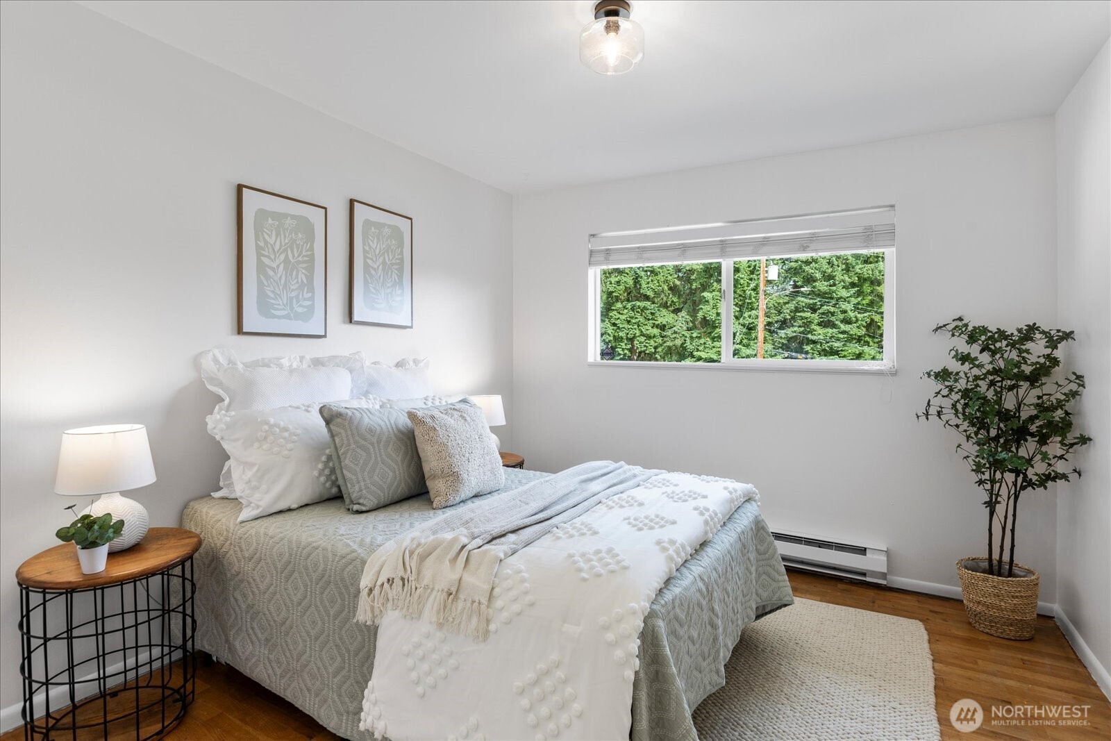 23908 80th Place West Edmonds, WA 98026 - Photo 17 of 40 a bedroom with a bed and a potted plant