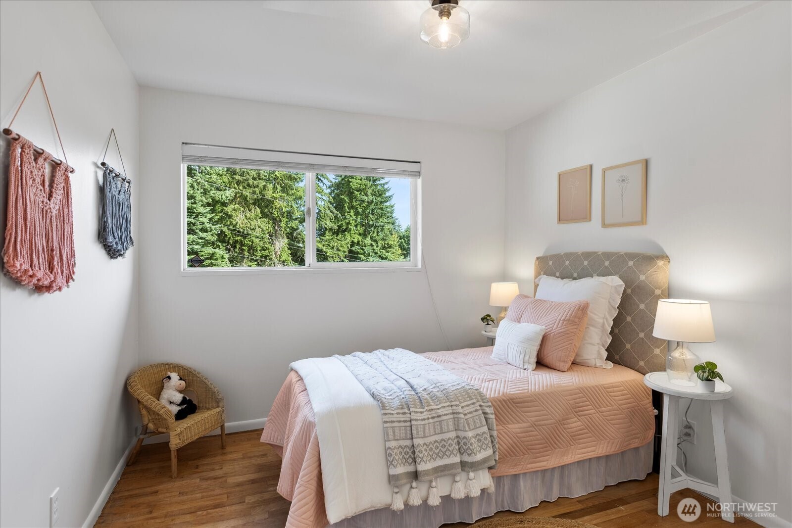 23908 80th Place West Edmonds, WA 98026 - Photo 19 of 40 a bedroom with a bed and a chair