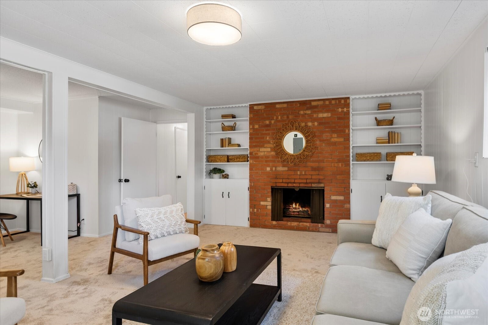 23908 80th Place West Edmonds, WA 98026 - Photo 23 of 40 a living room with furniture and a fireplace