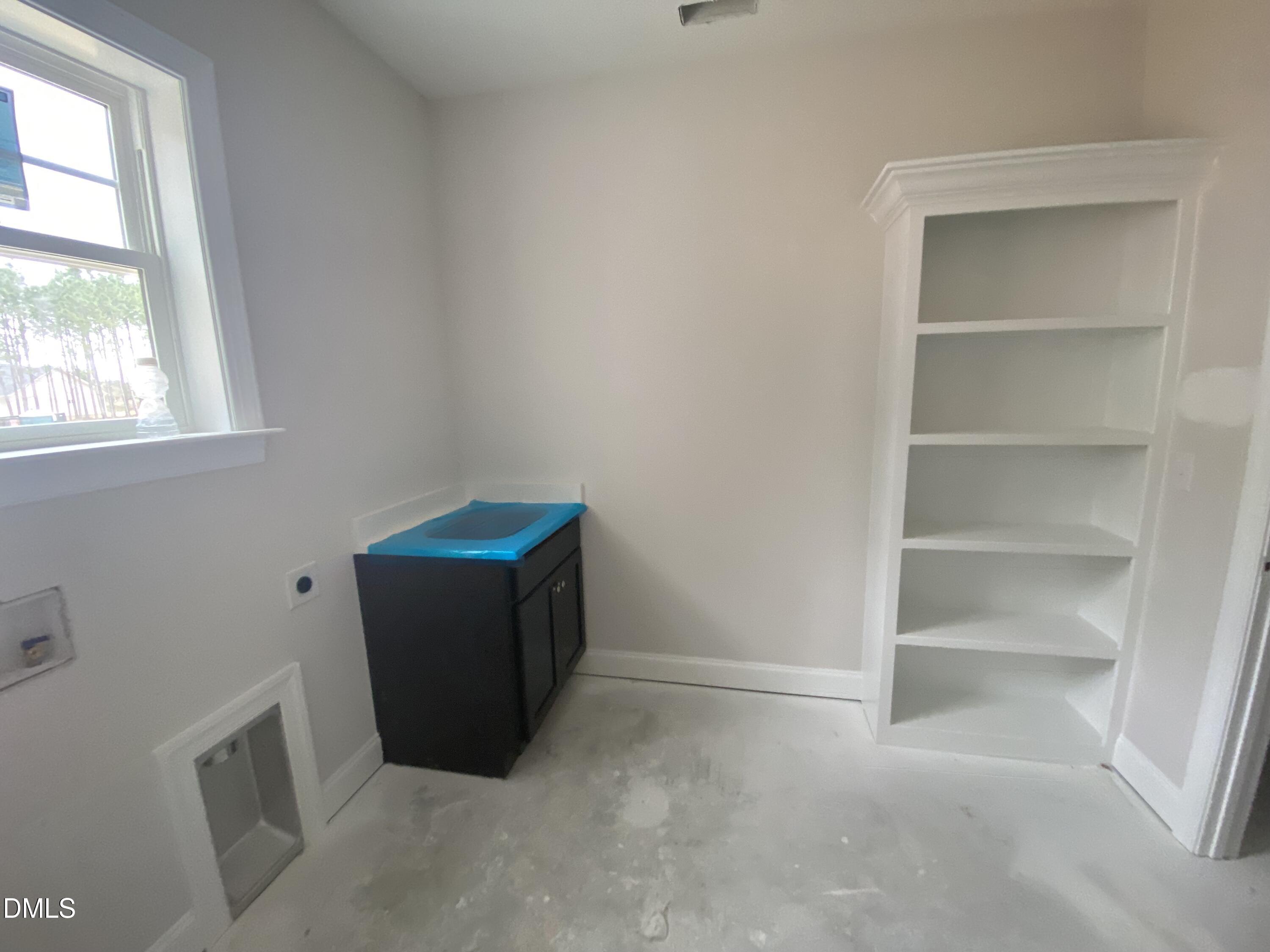 117 Rabbit Run Drive Smithfield, NC 27577 - Photo 10 of 16 a room with a cabinet and a window