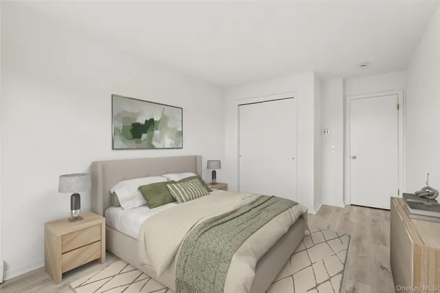 a bedroom with bed and window