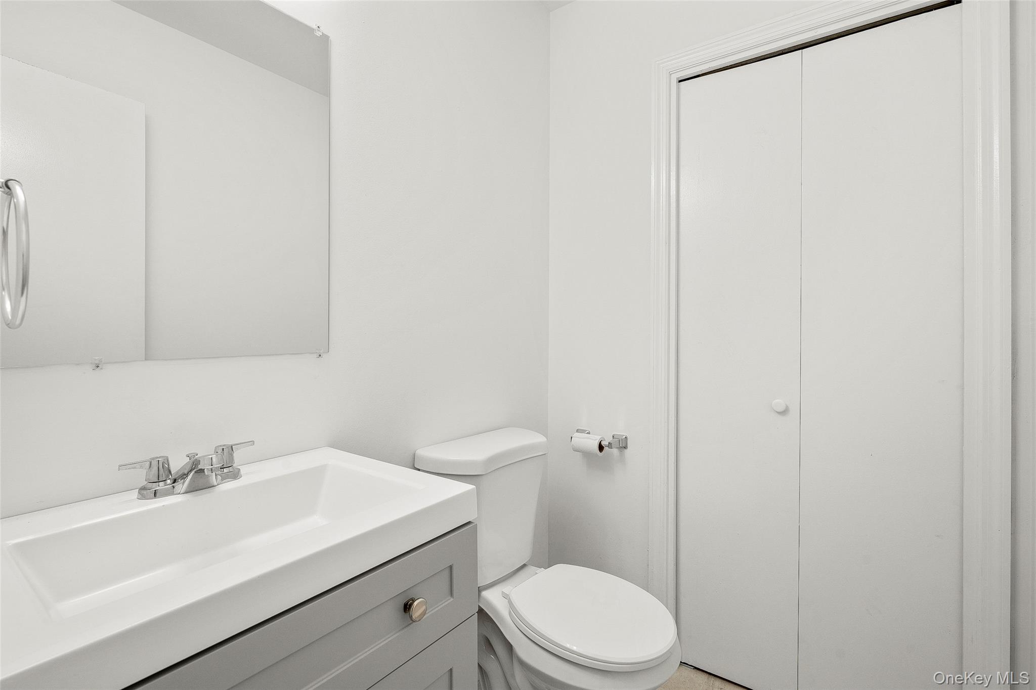 25 Laurel Court Fishkill, NY 12524 - Photo 12 of 26 a bathroom with a sink a toilet and shower