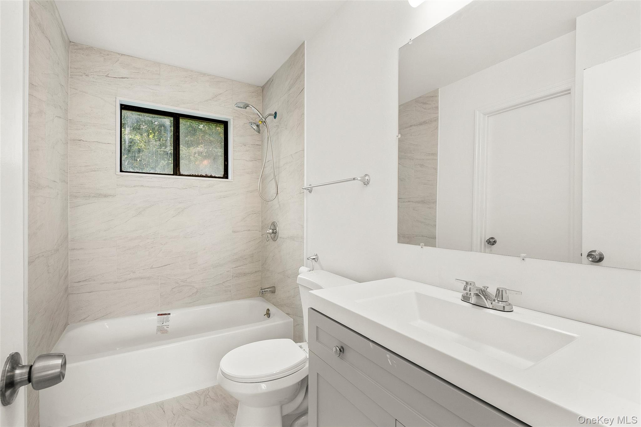 25 Laurel Court Fishkill, NY 12524 - Photo 13 of 26 a bathroom with a sink a toilet and a bathtub