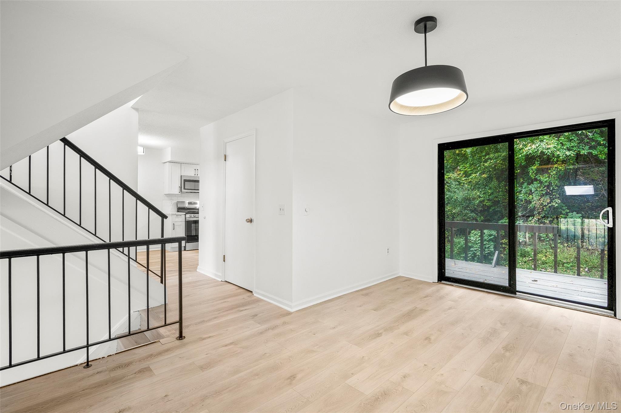 25 Laurel Court Fishkill, NY 12524 - Photo 15 of 26 a view of an empty room with wooden floor and a window
