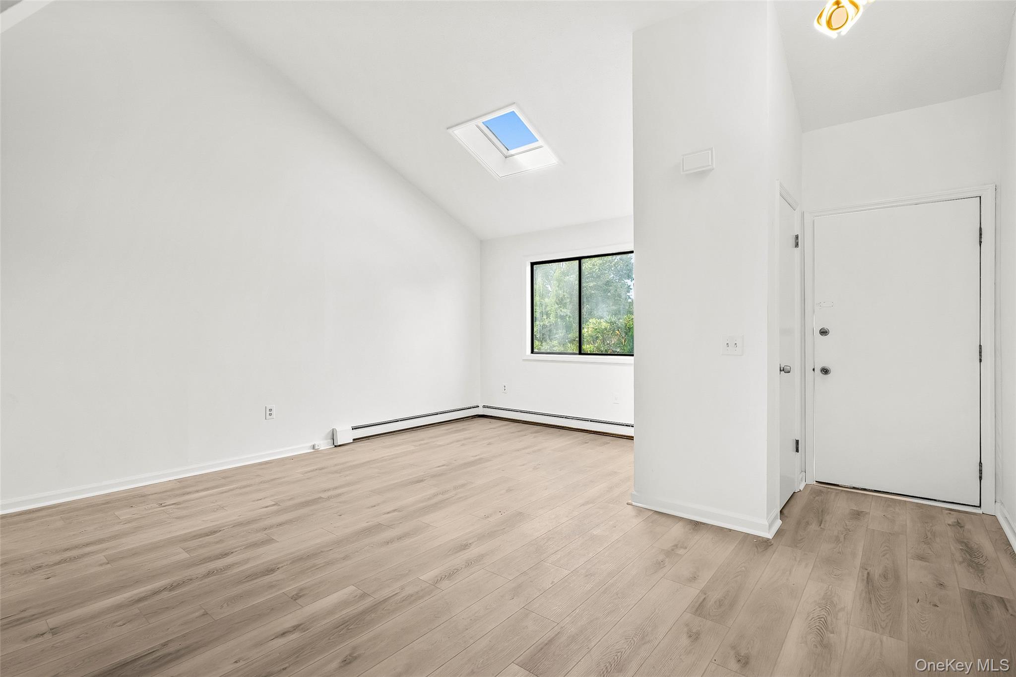 25 Laurel Court Fishkill, NY 12524 - Photo 18 of 26 an empty room with wooden floor and windows