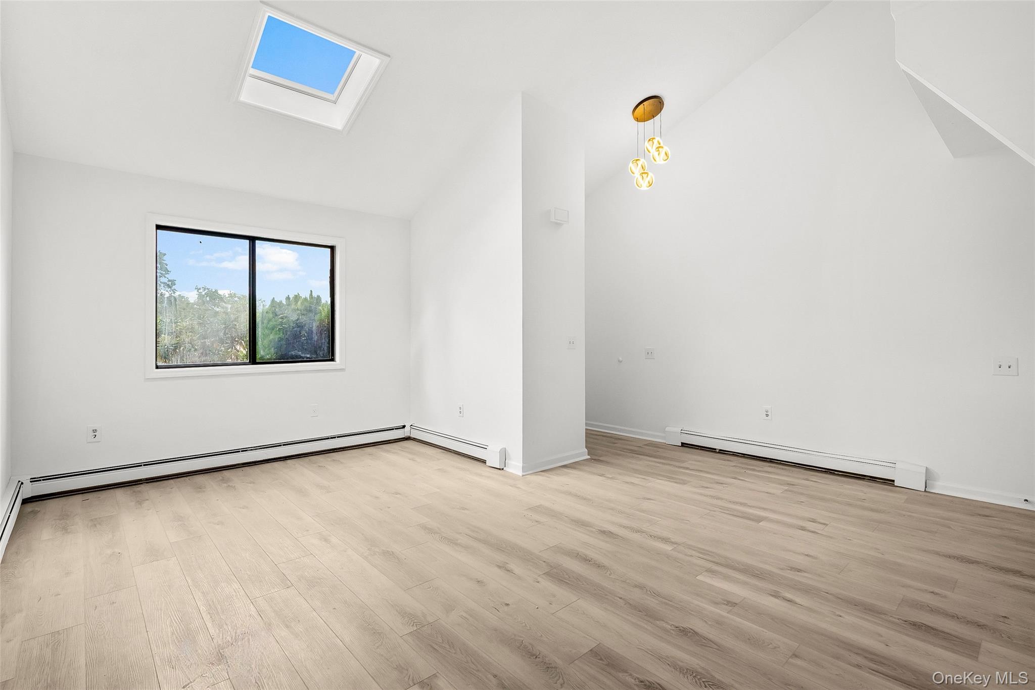 25 Laurel Court Fishkill, NY 12524 - Photo 19 of 26 an empty room with wooden floor and windows