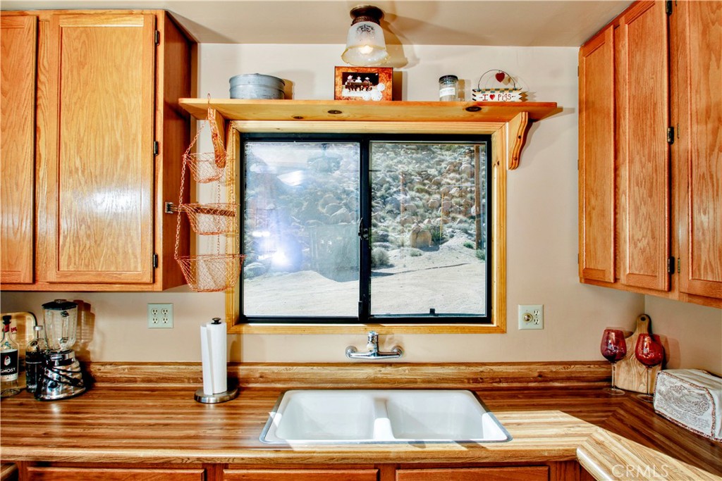 4650 Sizer Canyon Road Johnson Valley, CA 92285 - Photo 8 of 36 a view of a kitchen with a sink and cabinets