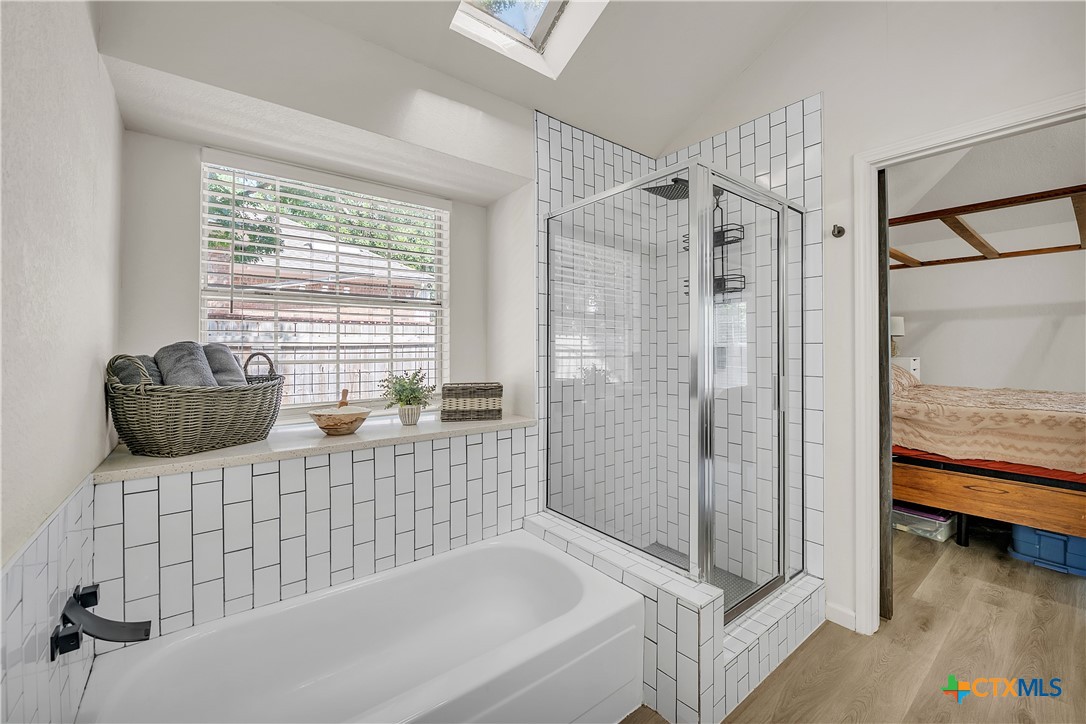 3905 Tyler Trail Temple, TX 76504 - Photo 15 of 31 a bathroom with a tub shower and sink