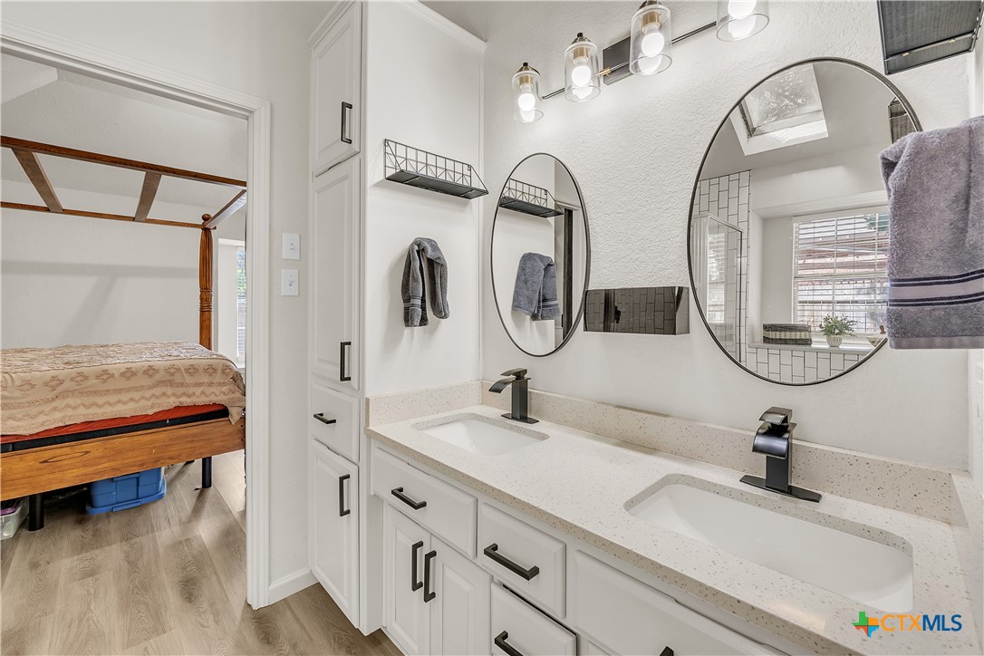 3905 Tyler Trail Temple, TX 76504 - Photo 16 of 31 a bathroom with a sink and a mirror