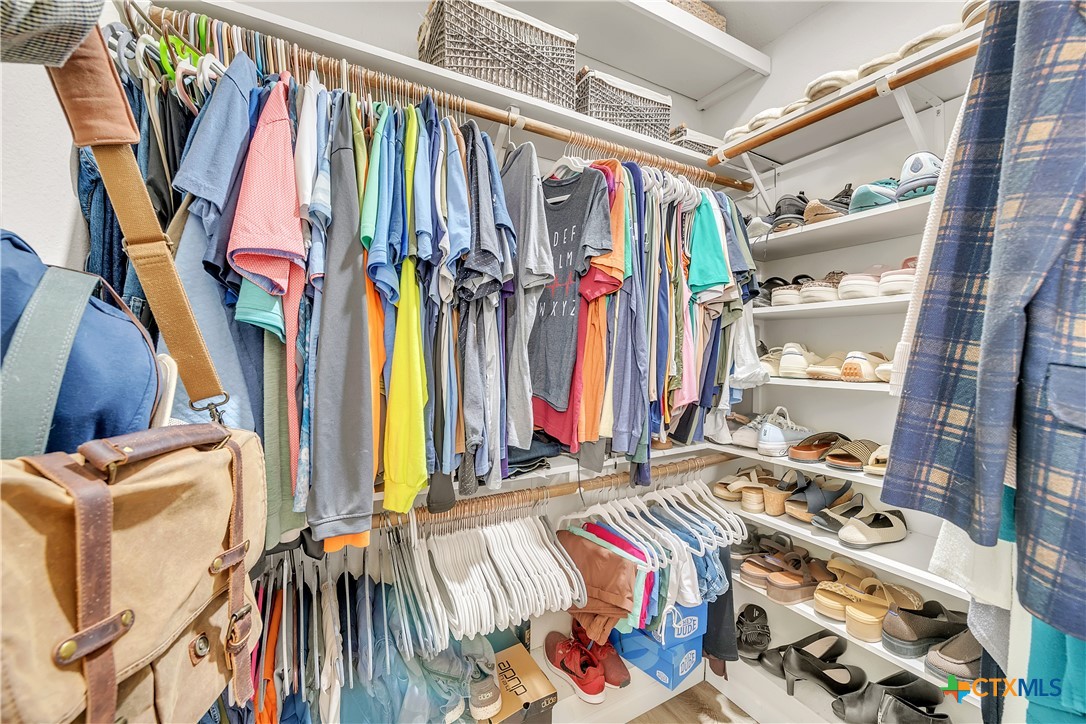 3905 Tyler Trail Temple, TX 76504 - Photo 18 of 31 a view of walk in closet with clothes and shoes