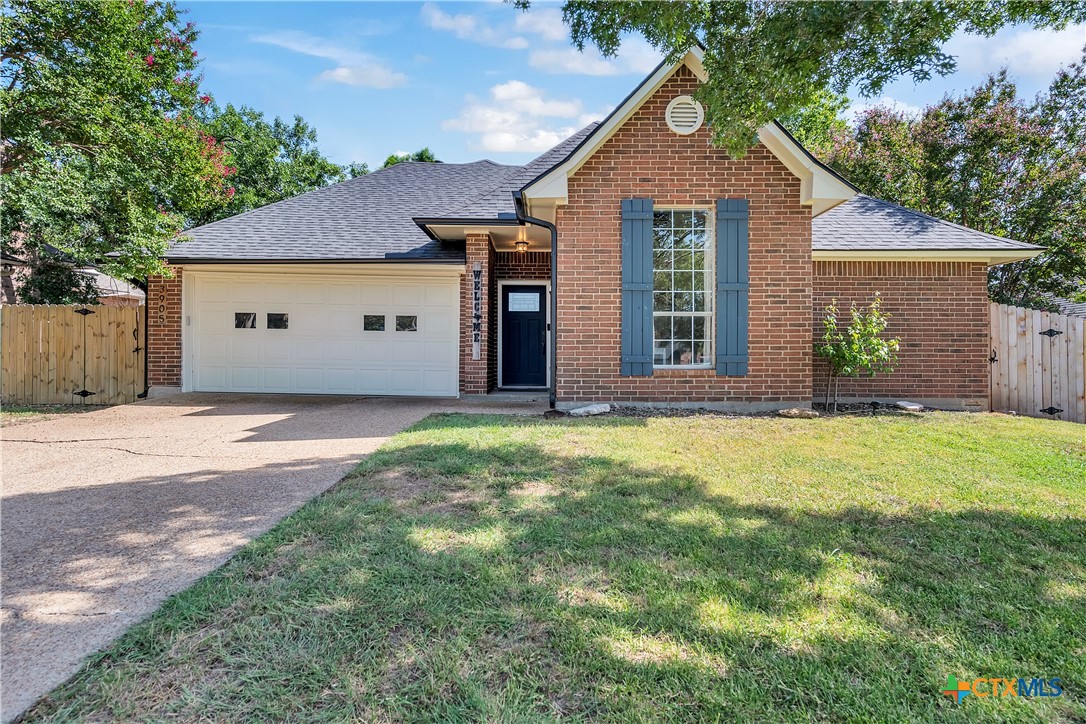 3905 Tyler Trail Temple, TX 76504 - Photo 2 of 31 a front view of a house with a yard and garage