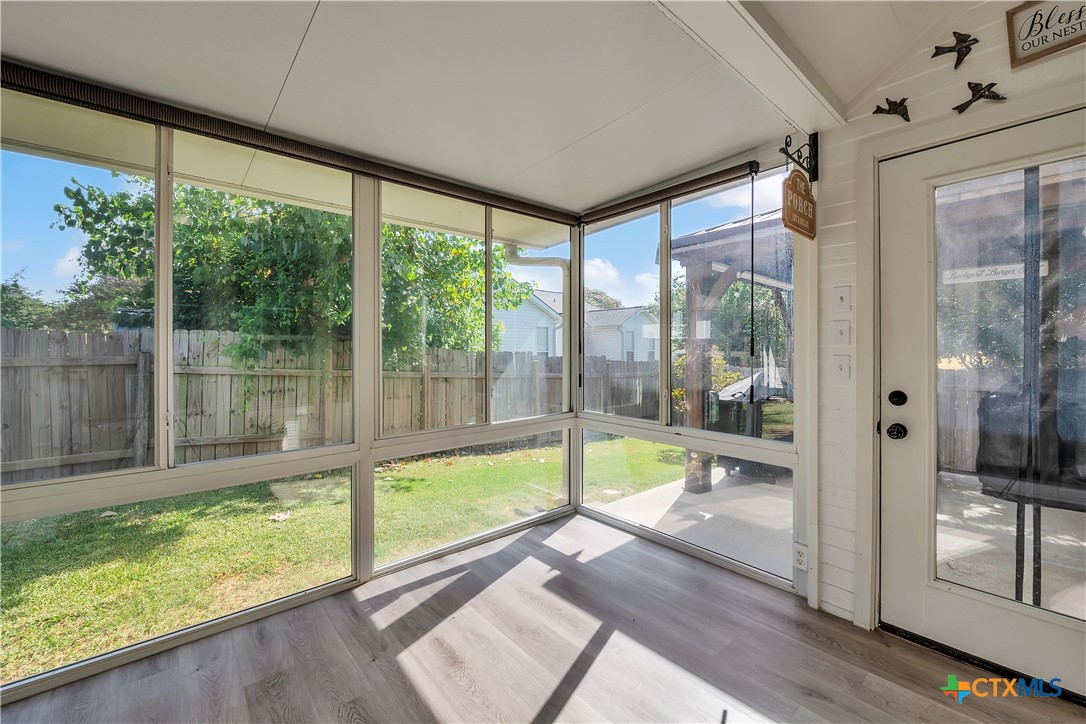 3905 Tyler Trail Temple, TX 76504 - Photo 27 of 31 a view of a room with a large window and wooden floor