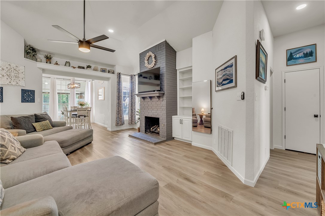 3905 Tyler Trail Temple, TX 76504 - Photo 3 of 31 a living room with furniture and a fireplace