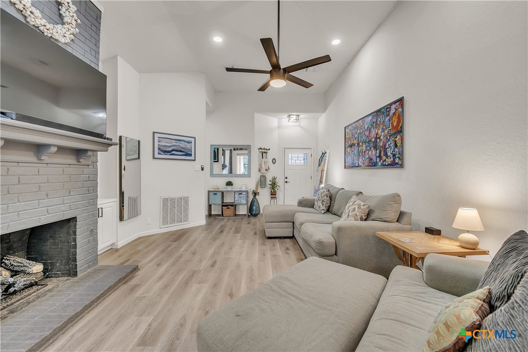 3905 Tyler Trail Temple, TX 76504 - Photo 6 of 31 a living room with furniture and a fireplace