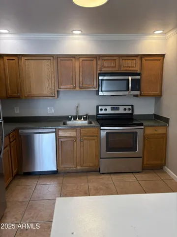 a kitchen with a stove and a microwave