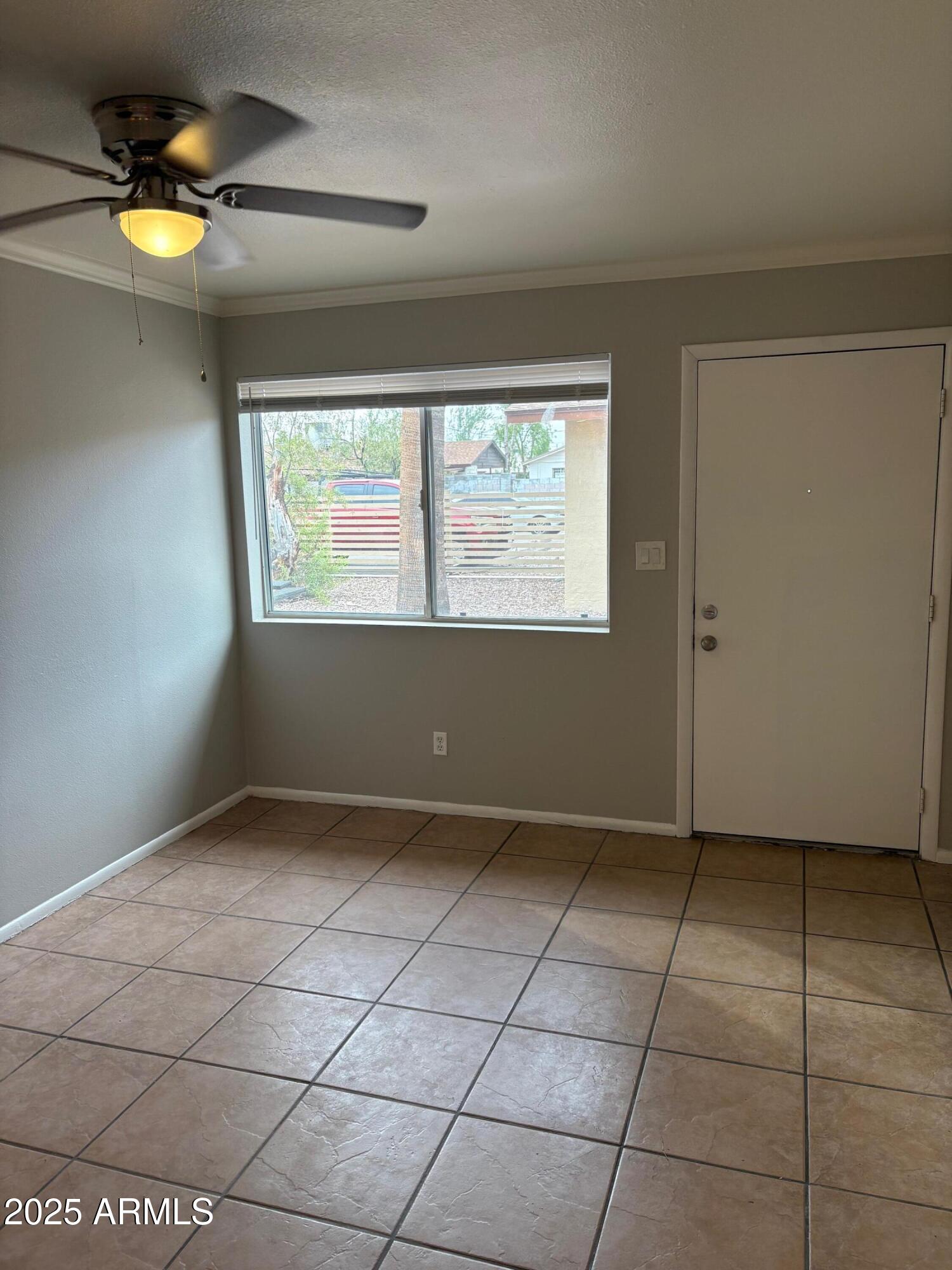 909 South Priest Drive, Unit 10 Tempe, AZ 85281 - Photo 3 of 14 a view of an empty room and window