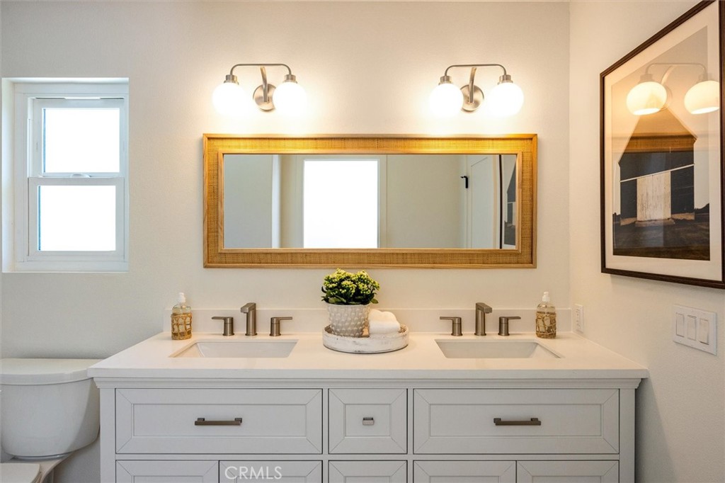 4255 San Benito Road Atascadero, CA 93422 - Photo 16 of 51 a bathroom with a sink vanity granite and a toilet