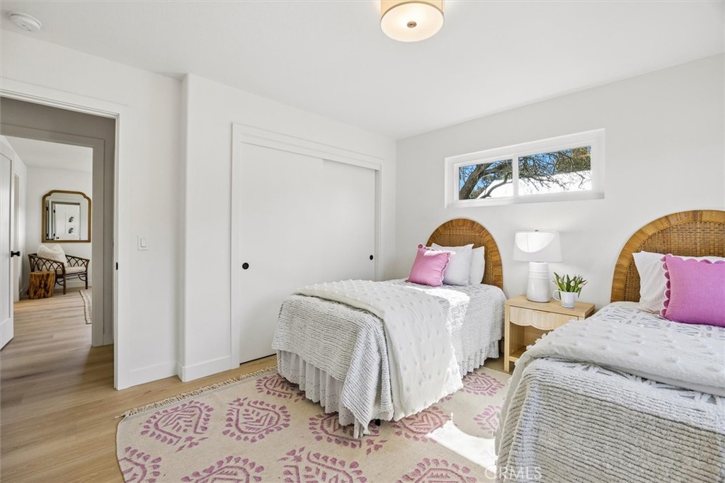 4255 San Benito Road Atascadero, CA 93422 - Photo 22 of 51 a bedroom with a bed and wooden floor