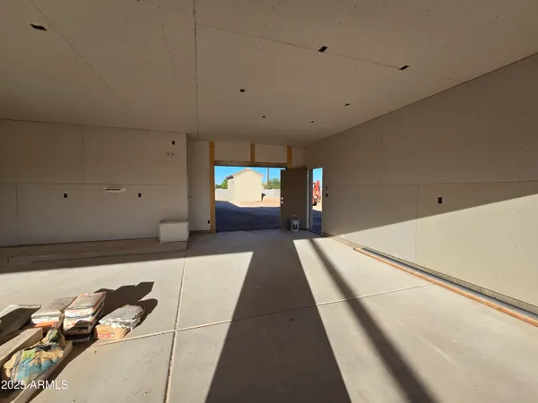 a hallway with a large white bed