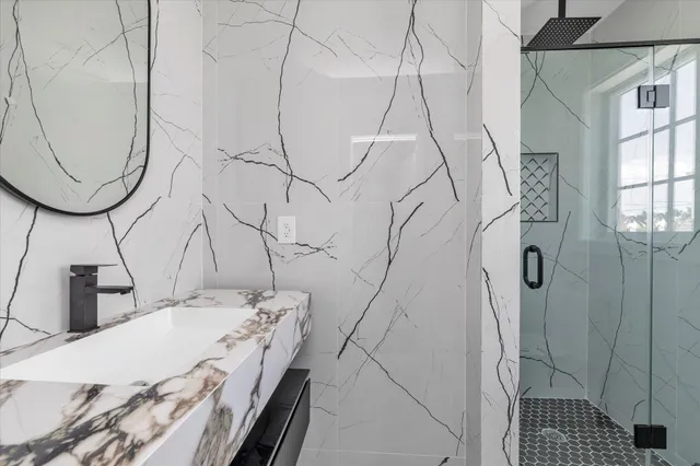 an empty room with wooden floor and window