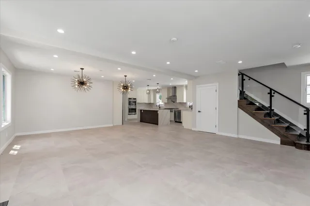 an ocean room with windows and fan