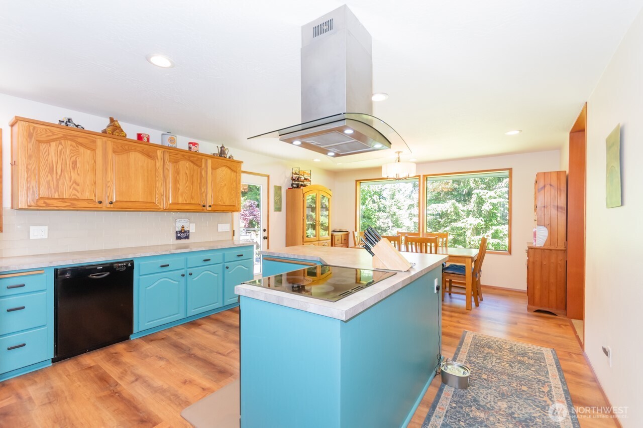 492 Walkabout Way Port Angeles, WA 98363 - Photo 13 of 40 a kitchen with a sink stove and cabinets