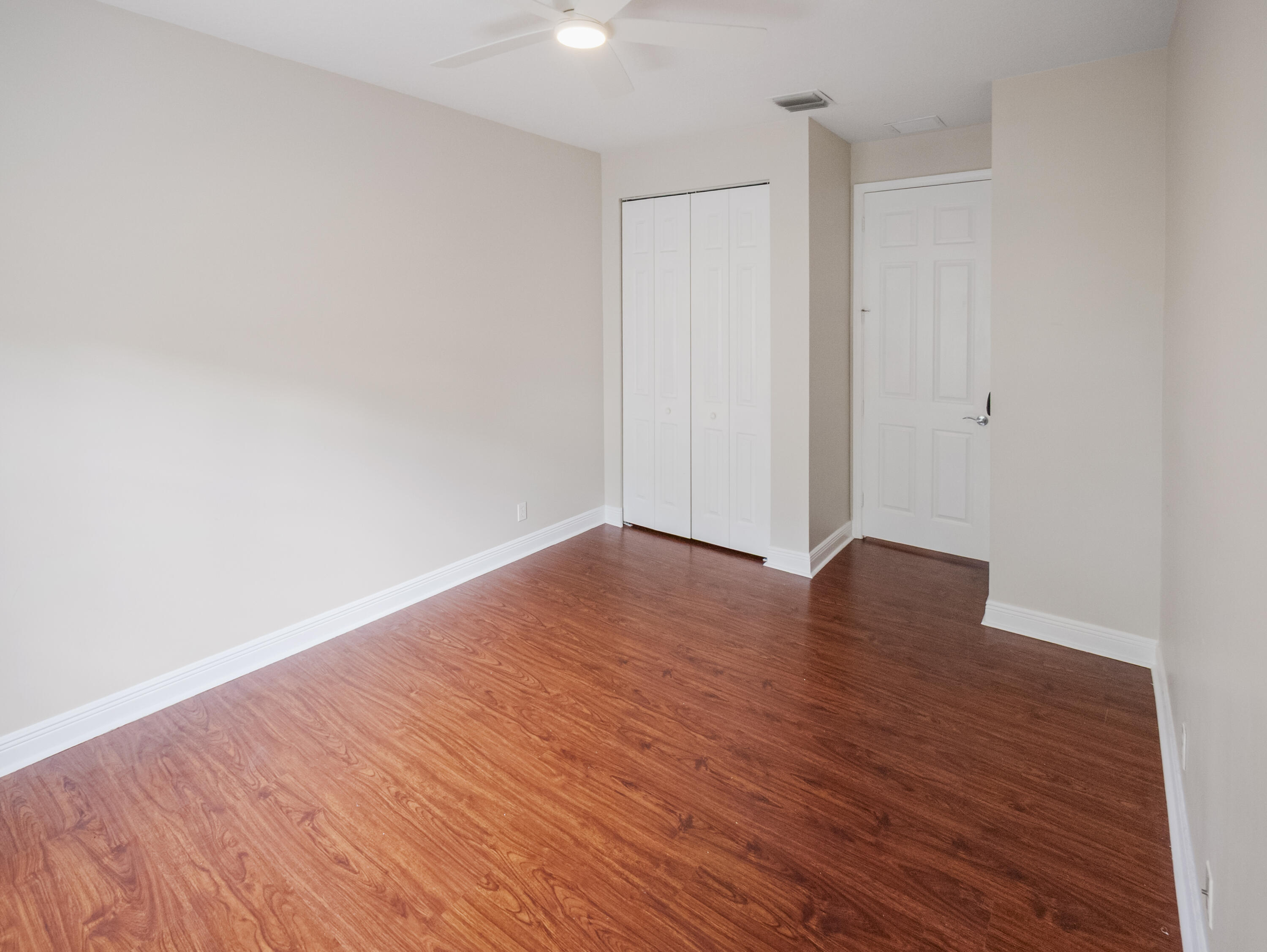 148 Morning Dew Circle Jupiter, FL 33458 - Photo 18 of 21 an empty room with wooden floor