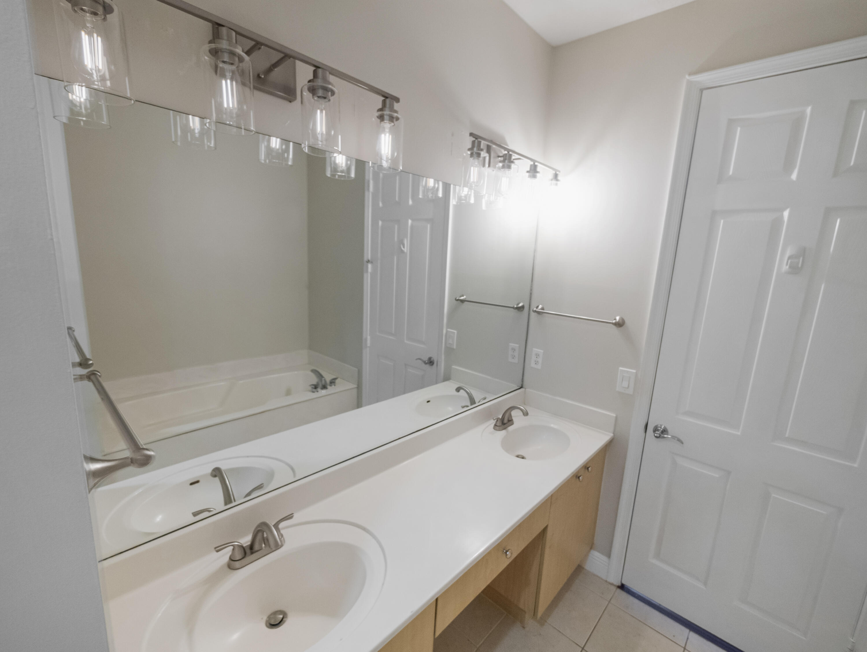 148 Morning Dew Circle Jupiter, FL 33458 - Photo 19 of 21 a bathroom with a sink and mirror