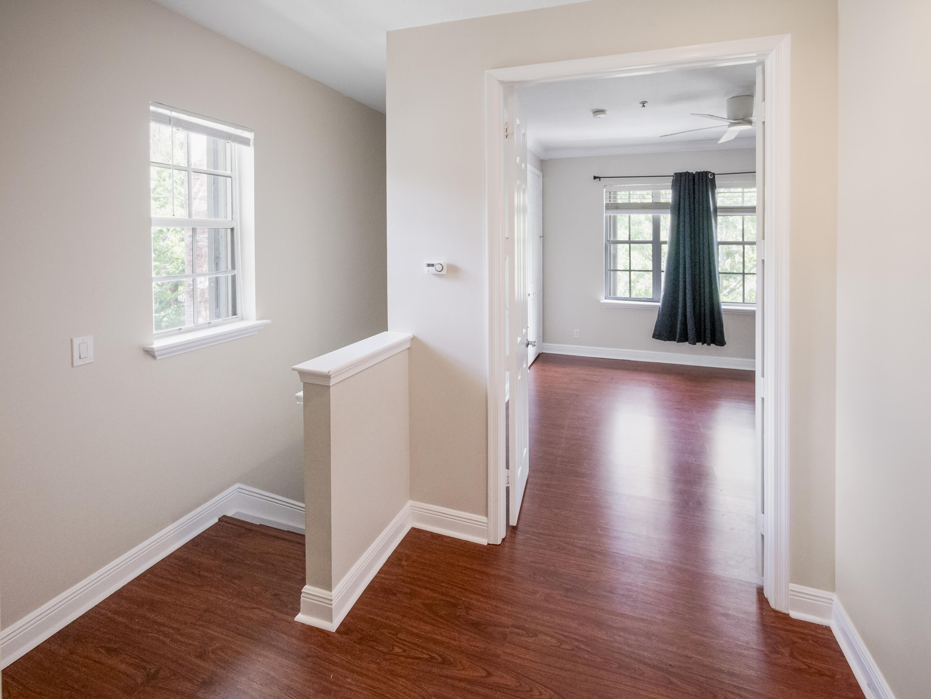 148 Morning Dew Circle Jupiter, FL 33458 - Photo 21 of 21 an empty room with wooden floor and windows