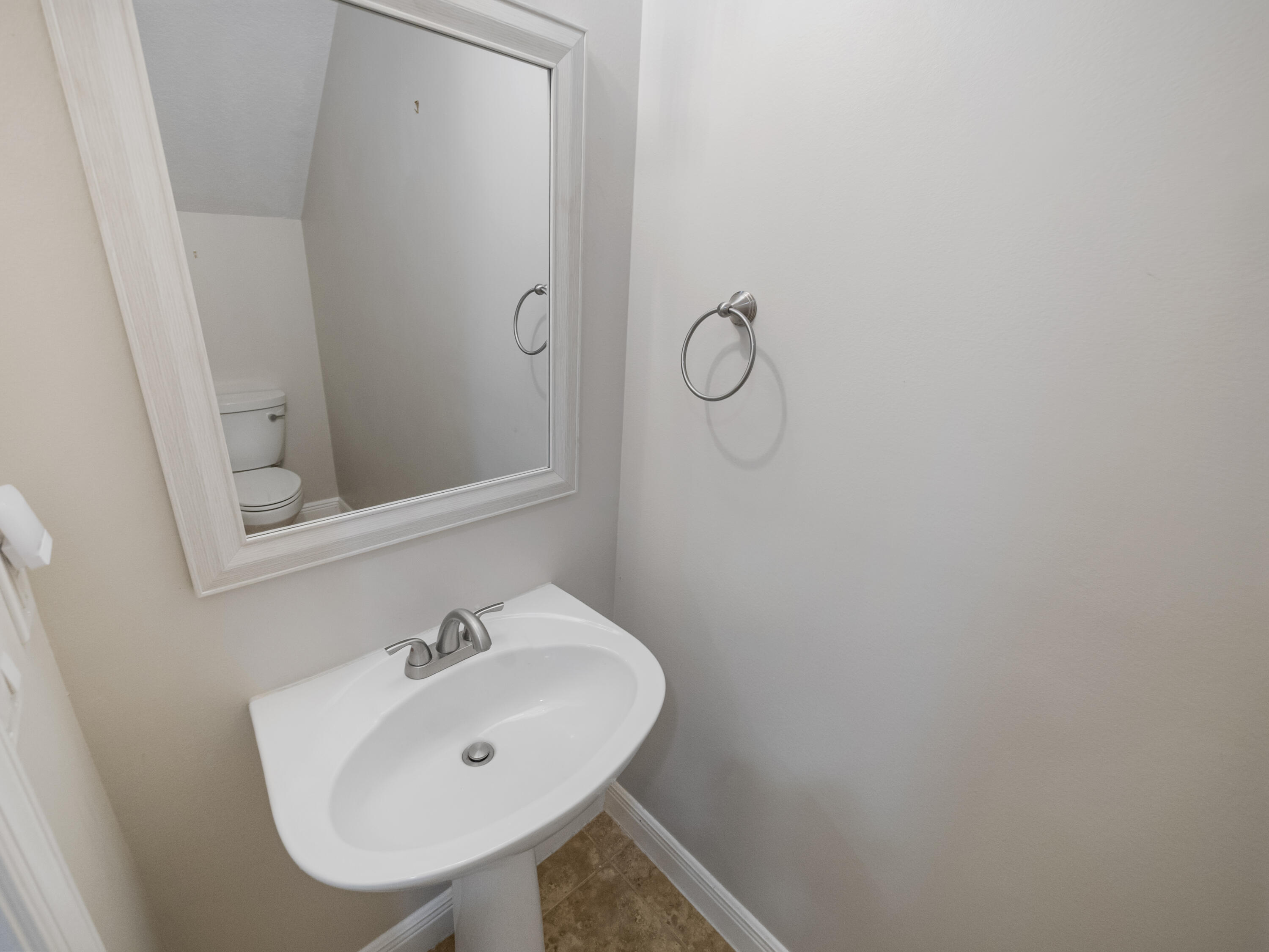 148 Morning Dew Circle Jupiter, FL 33458 - Photo 7 of 21 a bathroom with a sink and a mirror