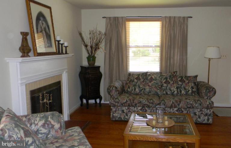 2015 Winford Road Baltimore, MD 21239 - Photo 2 of 22 a living room with furniture and a fireplace