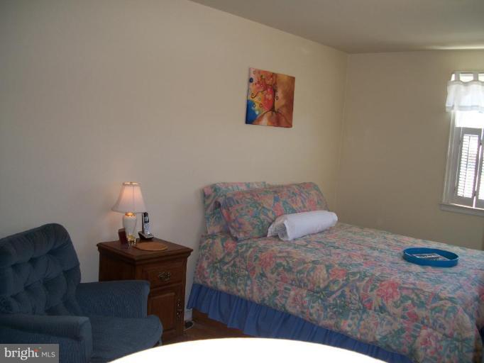2015 Winford Road Baltimore, MD 21239 - Photo 11 of 22 a bedroom with a bed and a window