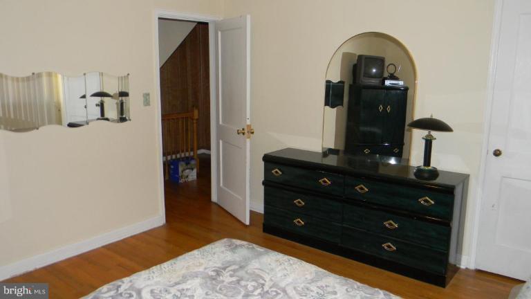 2015 Winford Road Baltimore, MD 21239 - Photo 19 of 22 a bedroom with a bed and a dresser