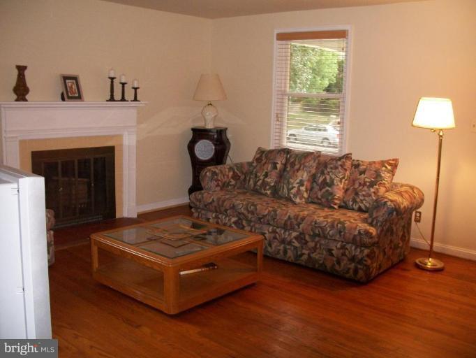 2015 Winford Road Baltimore, MD 21239 - Photo 4 of 22 a living room with furniture and a fireplace