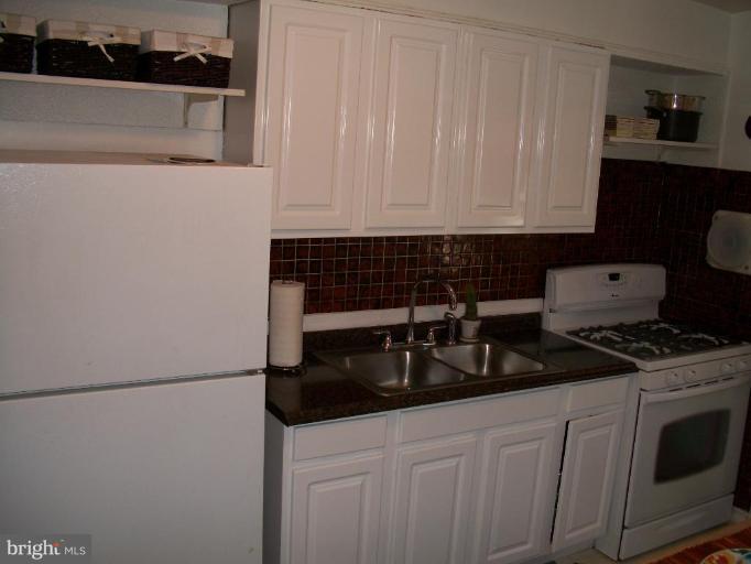 2015 Winford Road Baltimore, MD 21239 - Photo 8 of 22 a kitchen with a sink and cabinets