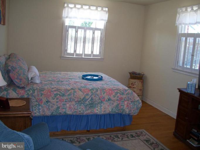 2015 Winford Road Baltimore, MD 21239 - Photo 10 of 22 a bedroom with a bed and wooden floor
