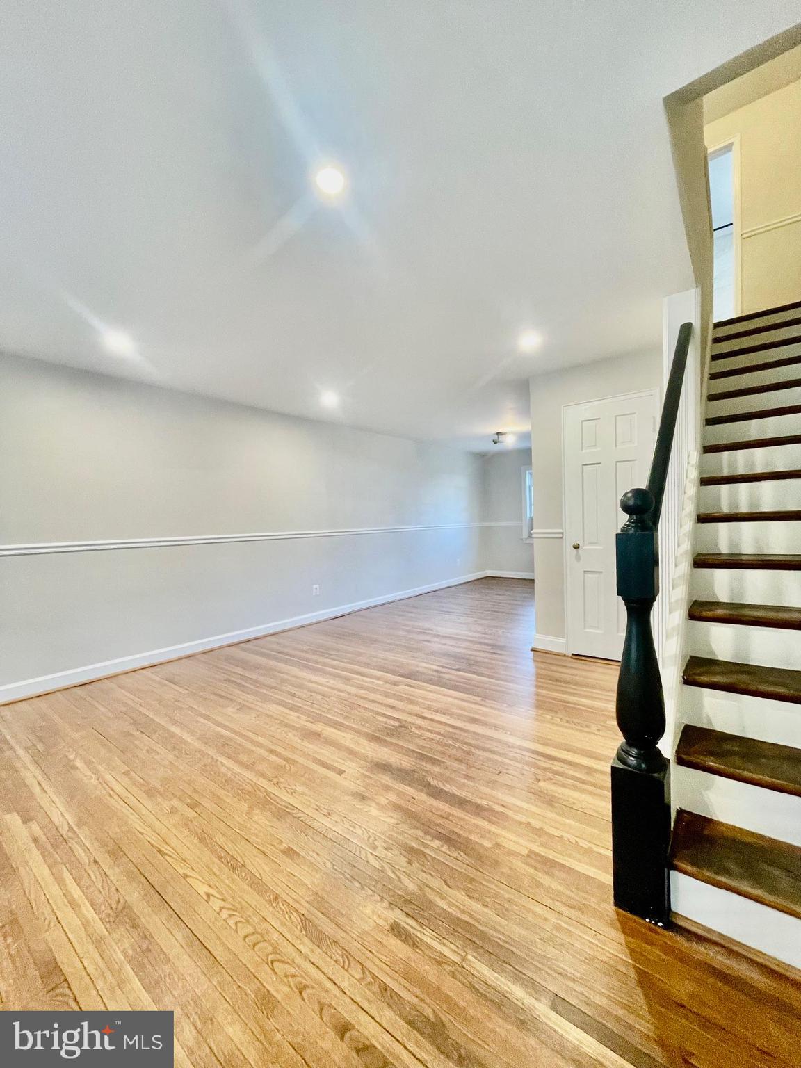 2809 A 16th Road South, Unit 2809A Arlington, VA 22204 - Photo 2 of 13 a view of empty room with wooden floor and windows