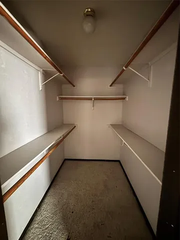 a view of a room with racks on the wall