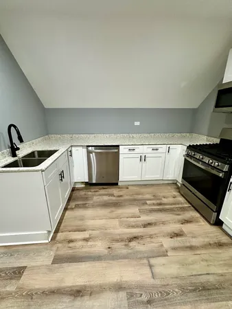 a view of a kitchen with a sink