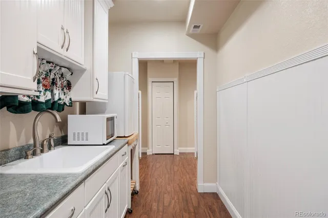 a bathroom with a granite countertop sink vanity granite and a mirror