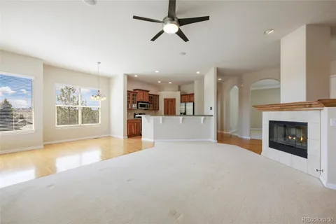 a view of a living room a window and a fireplace