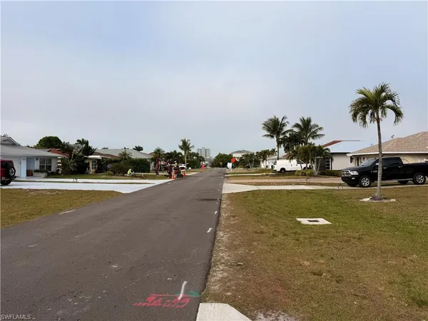 a view of street with houses
