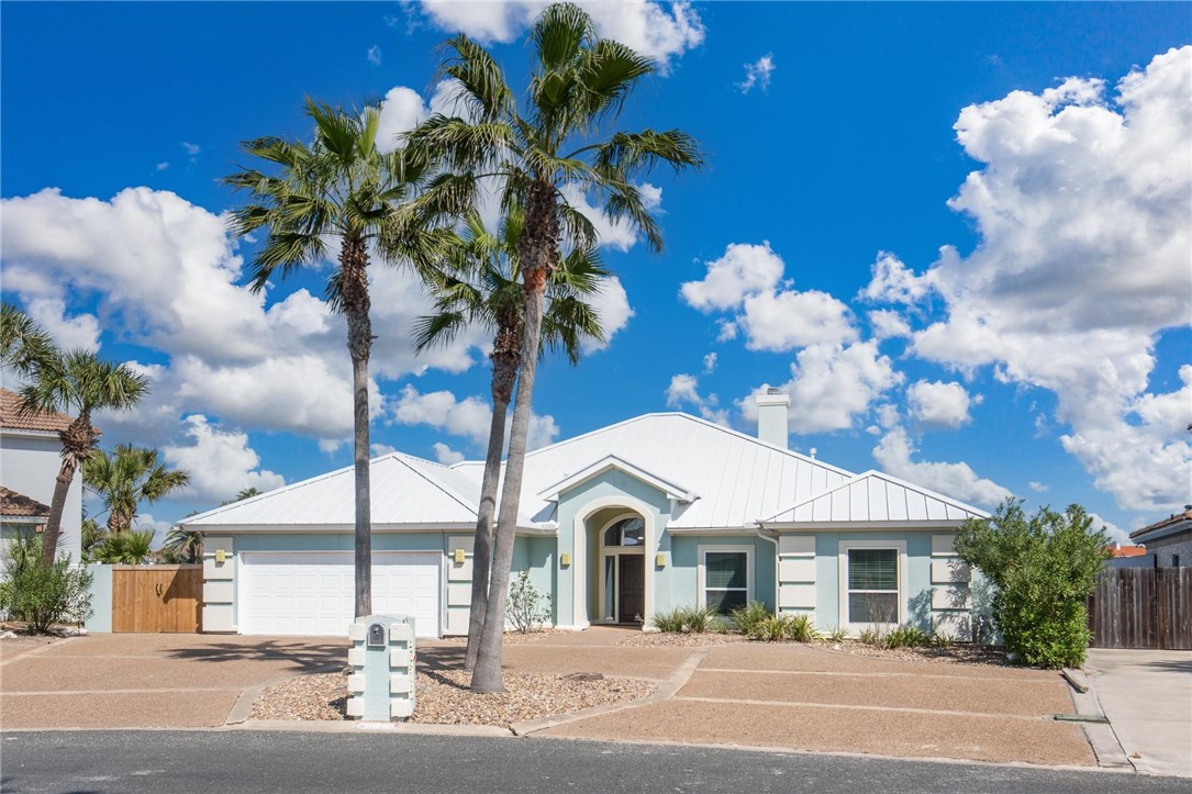 a view of a house with a cars park