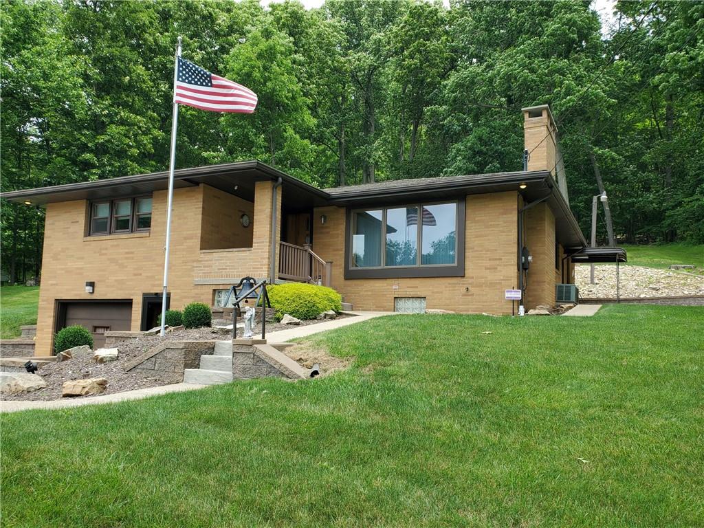 201 College Lodge Road Indiana, PA 15701 - Photo 1 of 20 a backyard of a house with table and chairs