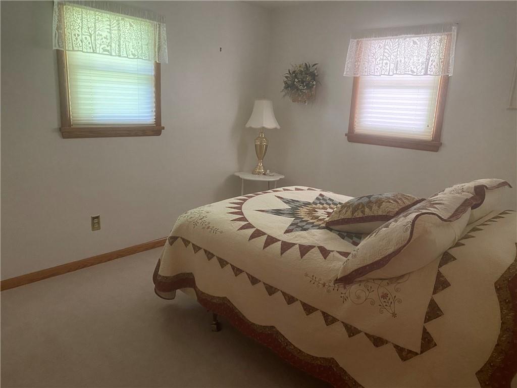 201 College Lodge Road Indiana, PA 15701 - Photo 11 of 20 a bed sitting in a bedroom next to a window