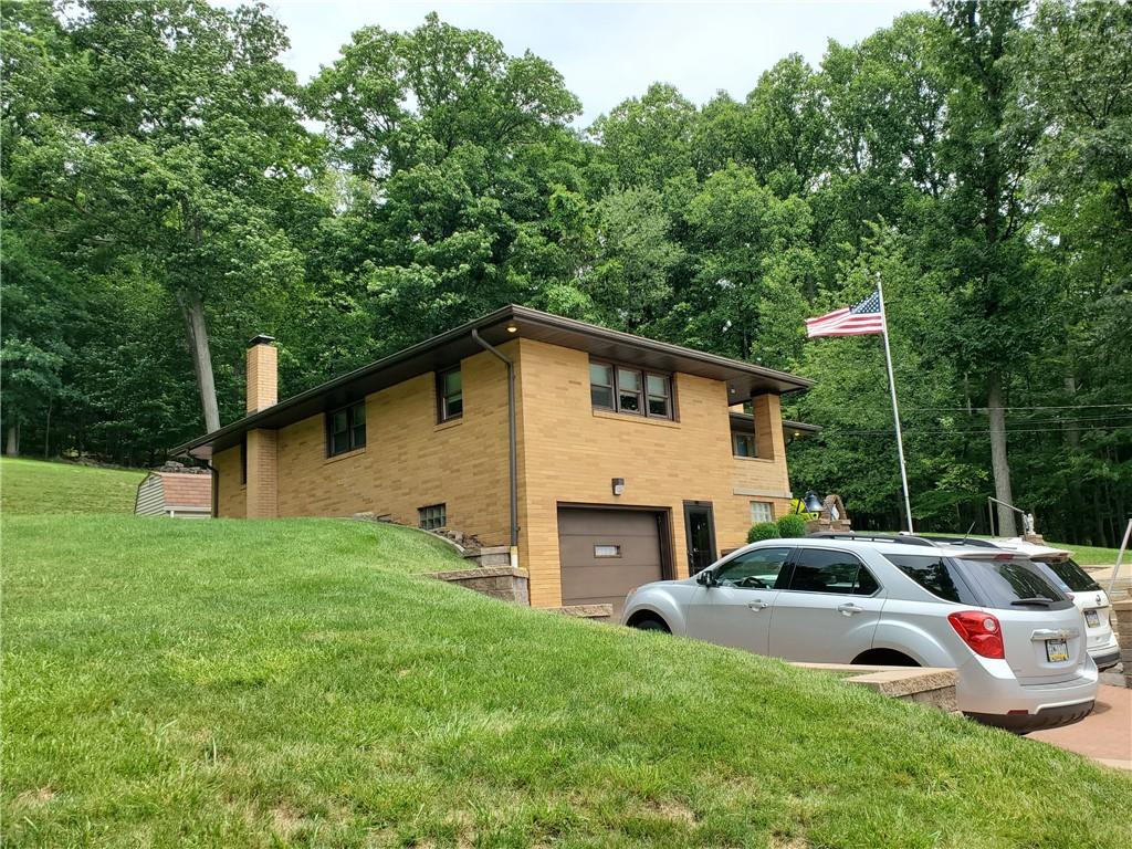 201 College Lodge Road Indiana, PA 15701 - Photo 3 of 20 a front view of a house with garden