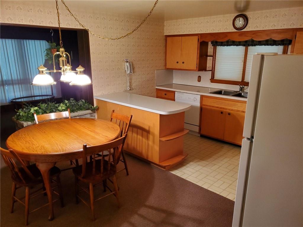 201 College Lodge Road Indiana, PA 15701 - Photo 5 of 20 a kitchen with a sink a table and chairs