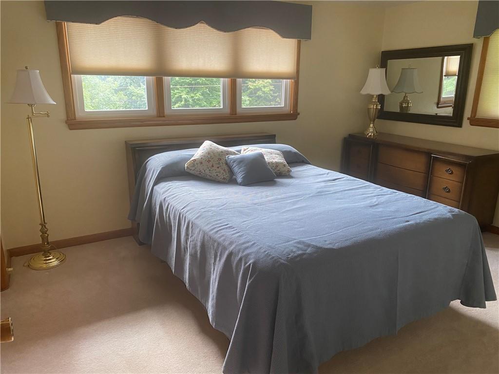 201 College Lodge Road Indiana, PA 15701 - Photo 10 of 20 a bed sitting in a bedroom next to a window