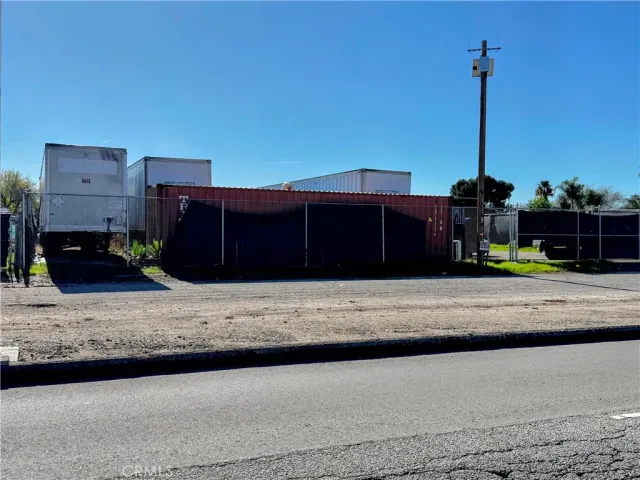 a view of a street with a building in the background